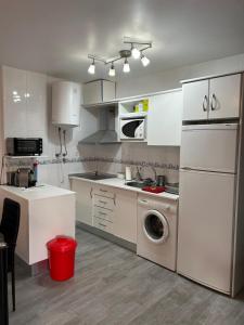 a kitchen with a washing machine and a washer at Apartment zona Naturista in Vera