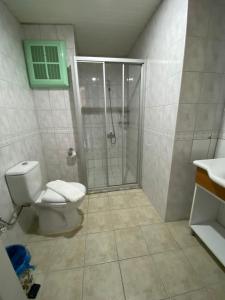 a bathroom with a shower and a toilet at Adora Pansiyon in Side +8 photos