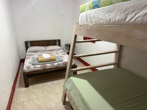 a bedroom with two bunk beds in a room at Paisa Territory Lodge in Jardin