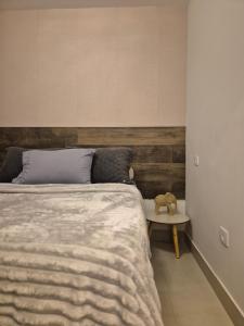 a bedroom with a bed and a teddy bear on a table at APTO 42M l 7 km Alphaville in Osasco +5 photos
