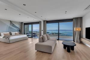 a living room with a couch and a bed and a tv at Villa Reina in Makarska +173 photos
