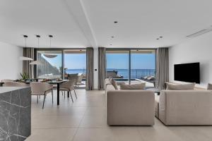 a living room with a view of the ocean at Villa Reina in Makarska