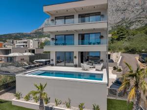 an aerial view of a house with a swimming pool at Villa Reina in Makarska