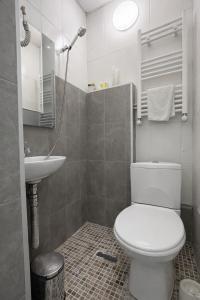 a bathroom with a toilet and a sink at DavidL Hotel Tbilisi in Tbilisi City +27 photos
