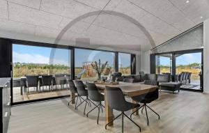 a dining room with a table and chairs at Awesome Home In Jerup With Sauna in Jerup