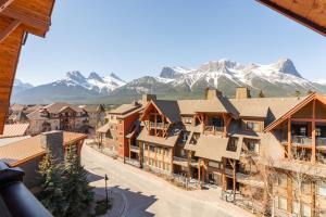 a view of a town with mountains in the background at Spectacular Penthouse With Amazing Views, Indoor Pool and Hot tub in Canmore
