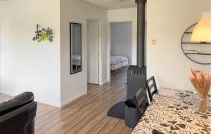 a living room with a wood stove in a room at Stunning Home In Ringkøbing With Wifi in Ringkøbing
