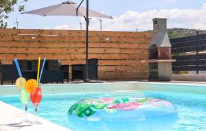 a swimming pool with a drink at Amazing Home In Dugobabe in Dugobabe +18 photos