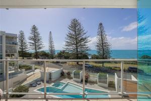 a view of the ocean from the balcony of a condo at Dwell @ 22, Oceanfront Apartment in Bargara