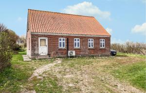 a small brick house with an orange roof at 3 Bedroom Stunning Home In Bedsted Thy in Bedsted Thy