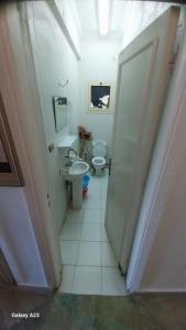 a bathroom with two toilets and a sink at casabianca north coast chalet code 20 in Borg El Arab +27 photos