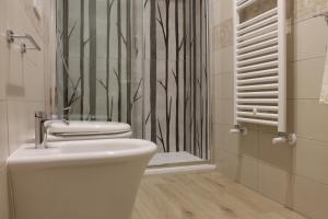 a bathroom with a toilet and a shower at Villa Carbonilla in Torre del Greco +47 photos