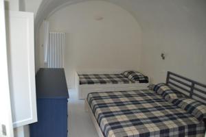 A bed or beds in a room at Terra Azzurra