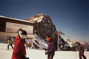 a group of people on a ski slope on a mountain at Alpine Nest Tiltlis, Garden, Central, Lucerne in Engelberg