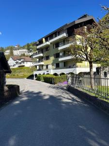 an empty street in front of a apartment building at Alpine Nest Tiltlis, Garden, Central, Lucerne in Engelberg