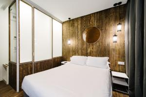Postel nebo postele na pokoji v ubytování Atypik Hotel