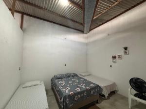 a bedroom with a bed in a room with a ceiling at Casa por temporada - Espaço Oxente - Lazer e eventos in Paulo Afonso +10 photos