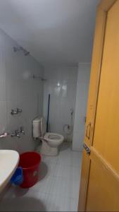a bathroom with a toilet and a sink at Stay with Comfort in Cox's Bazar