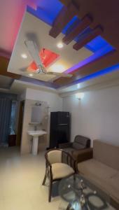 a living room with a couch and a table at Stay with Comfort in Cox's Bazar
