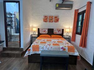 a bedroom with a bed with a quilt on it at Don Lioni in El Valle de Antón