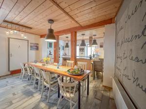 a kitchen and dining room with a long table and chairs at Quelle in Bernkastel-Kues