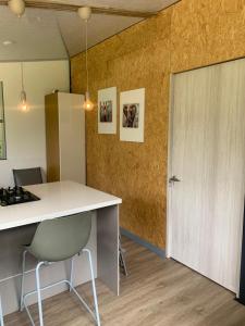 a kitchen with a white counter and a door at Cabaña Corolaine in San Francisco +26 photos
