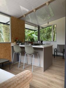 a kitchen with a table and chairs in a room at Cabaña Corolaine in San Francisco