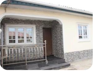 a front porch of a house with a balcony at Kadosh Homes - 2Bed Apartment in Magboro +3 photos