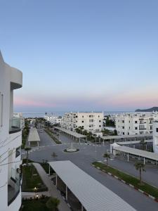 a view of a parking lot from a building at Cozy Flat Sea & Hills View in Marina Smir