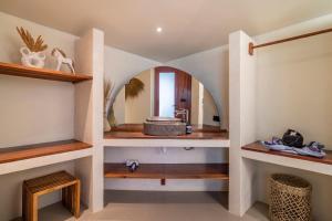 a bathroom with a sink and a mirror at MELO Gili Air in Gili Islands +34 photos