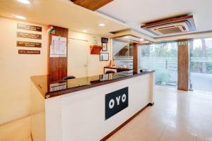 a kitchen with an oro sign on a counter at Hotel O Ganpati in Bhopal