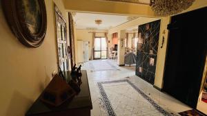a hallway of a home with a tile floor at Temple host in Cairo