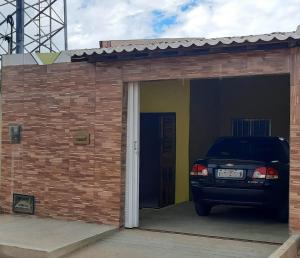a car parked inside of a brick garage at Recanto Life Beach in Camocim