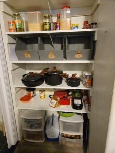 a refrigerator filled with pots and pans and food at Lillian's Cozy Corner in Palmer