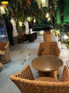a restaurant with a table and chairs and flowers at Hotel ELITE CHOICE in Ajmer