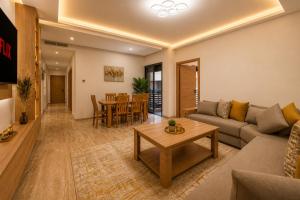 a living room with a couch and a table at Madani Palazza Appart & Duplex in Marrakesh