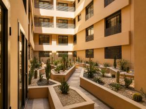 an apartment building with plants in the courtyard at Madani Palazza Appart & Duplex in Marrakesh