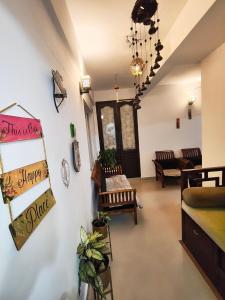 a living room with a couch and a table at Sky Loft in Trivandrum