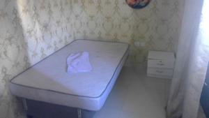 a bed with a towel on it in a room at wowspa in Ajman  +2 photos