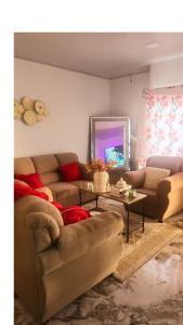 a living room with a couch and a table at Casa Lujosa in Choluteca