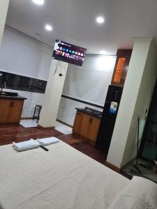 a room with a bed and a sign on the wall at RoofTop8 in Cochabamba