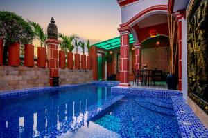 a swimming pool in a house with a house at 855 Villa Siem Reap in Siem Reap