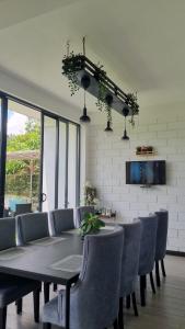 a dining room with a table and chairs at Aura Residence-Kandy in Katugastota