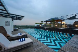 a swimming pool on the roof of a hotel at Noah Sky Suites in Cochin