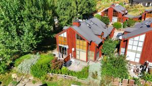 an aerial view of a red house with windows at Cardrona Sanctuary by Aotearoa Escapes in Cardrona