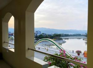 a view of a river from a balcony at Khách sạn Nậm Rốm in Diện Biên Phủ