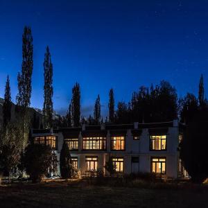 a large house at night with the lights on at Yarab tso hotel Tigger Nubra in Nubra