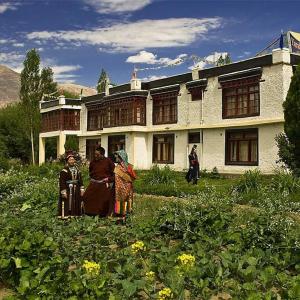 a group of people standing in front of a house at Yarab tso hotel Tigger Nubra in Nubra +22 photos