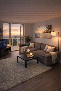 a living room with a couch and a table at 2b apartment by the Ocean in Sunny Isles Beach