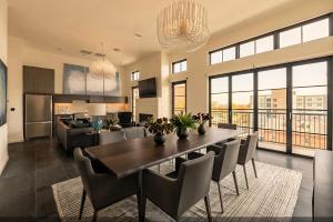 a dining room and living room with a table and chairs at The 121 Hotel in Nashville